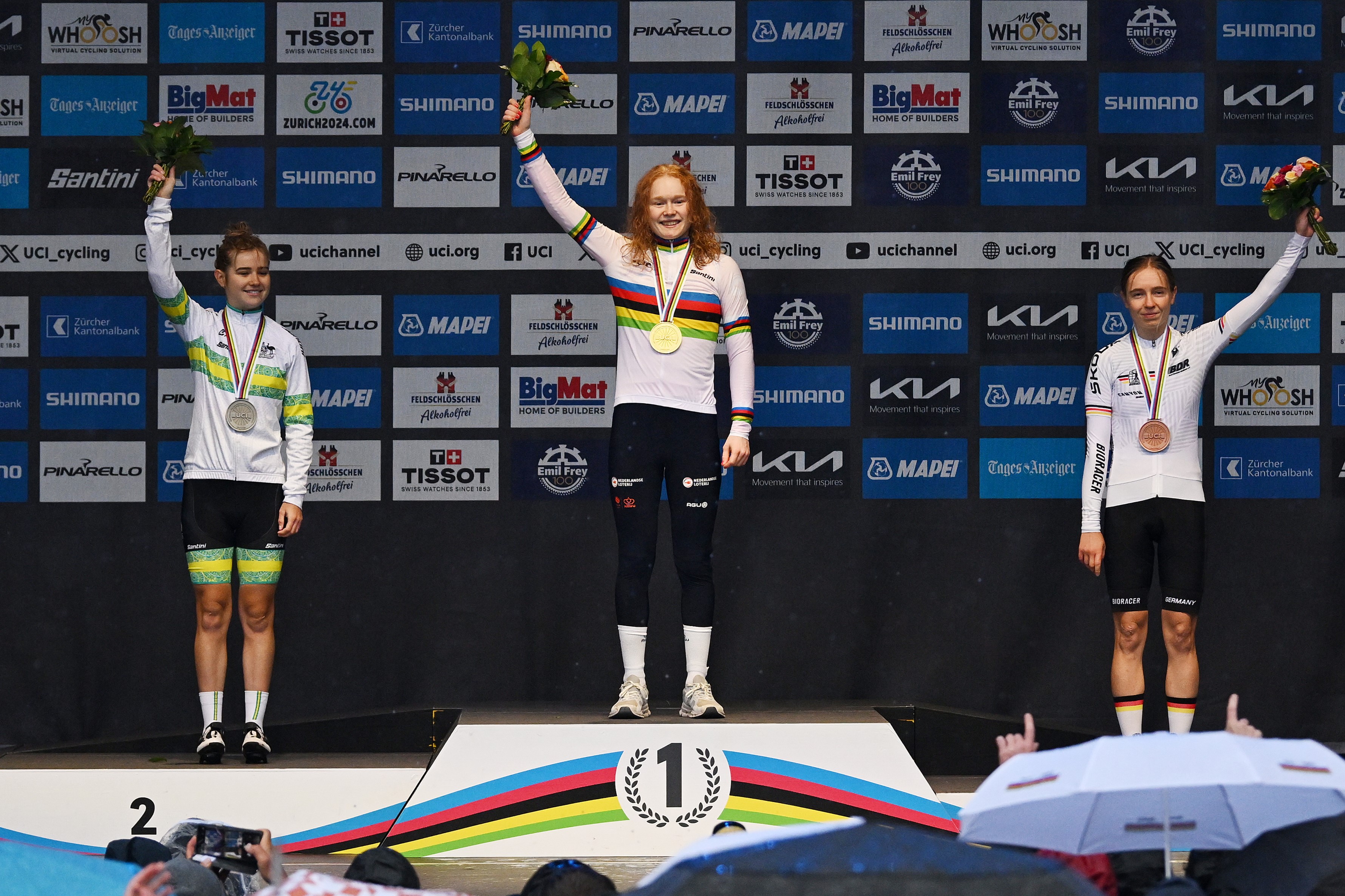 Puck Pieterse, silver medalist Neve Bradbury of the ARA Australian Cycling Team and Antonia Niedermaier on the podium during the UCI Cycling World Championships Zurich 2024, Women's U23 Road Race on September 28, 2024 in Zurich, Switzerland. (Photo by Dario Belingheri/Getty Images)